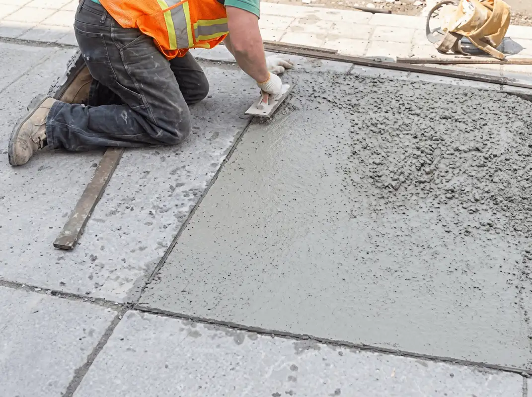 Professional repairing a concrete floor in Dayton, OH